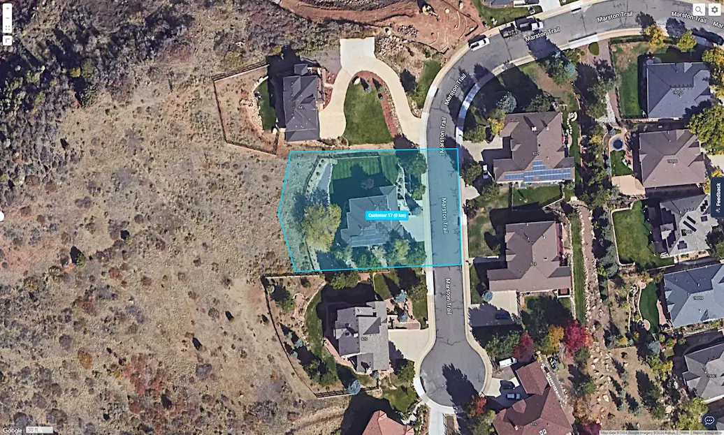 Residential geofence zone highlighted on a satellite map view for customer location tracking and fleet management